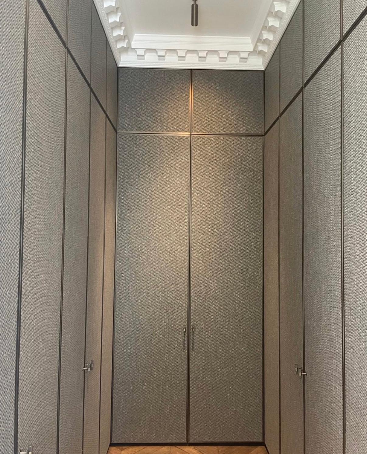 Floor-to-ceiling fitted wardrobes with decorative cornice